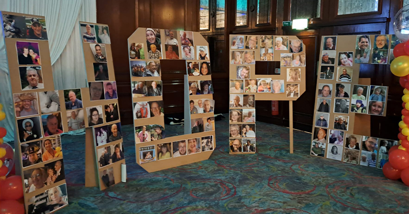 A collage board in the shape of the word 'HOPE'. The collage features photos of individuals and groups.